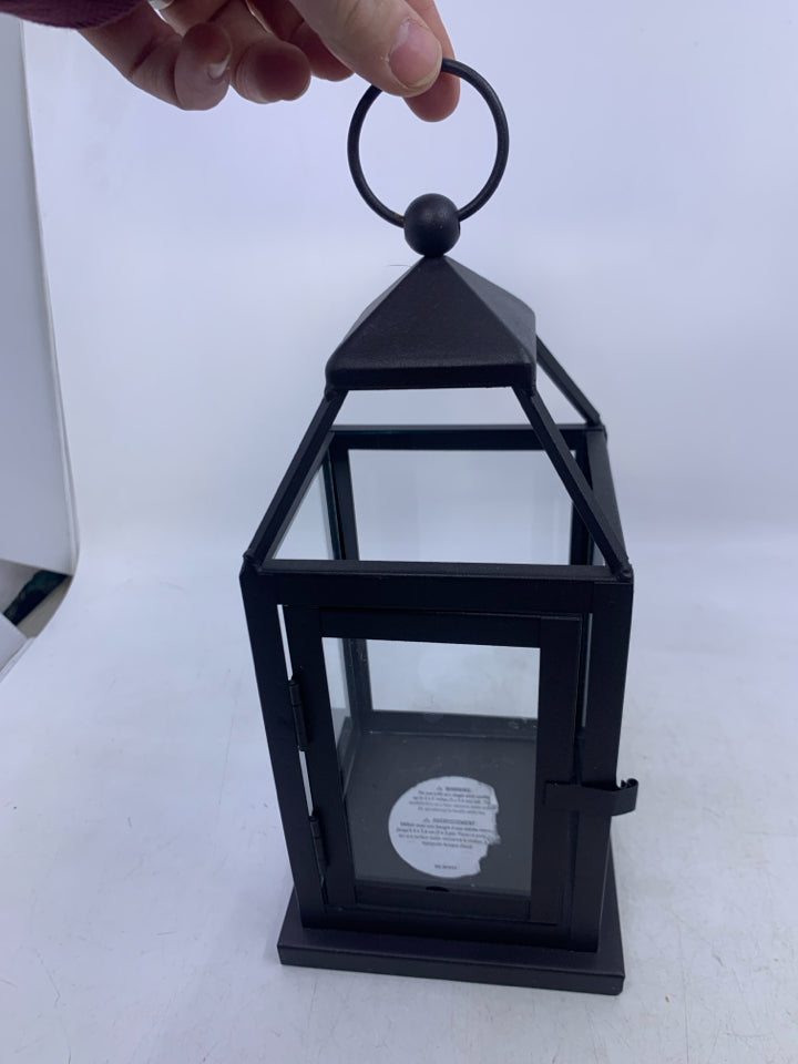 BROWN METAL TEA LIGHT HOLDER LANTERN.