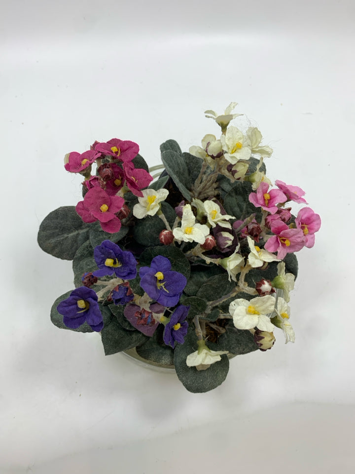 FAUX VIOLETS IN CUT GLASS BOWL.