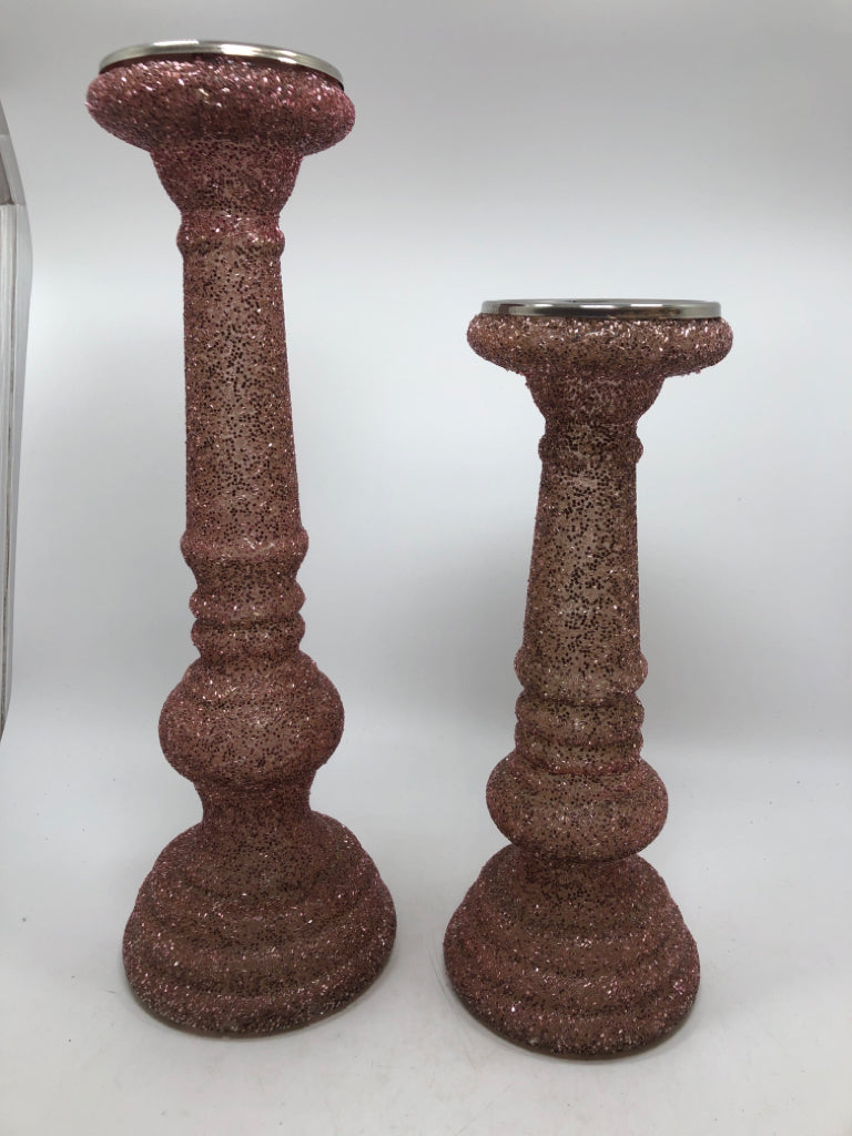 2 PINK GLITTER PILLAR CANDLE HOLDERS.