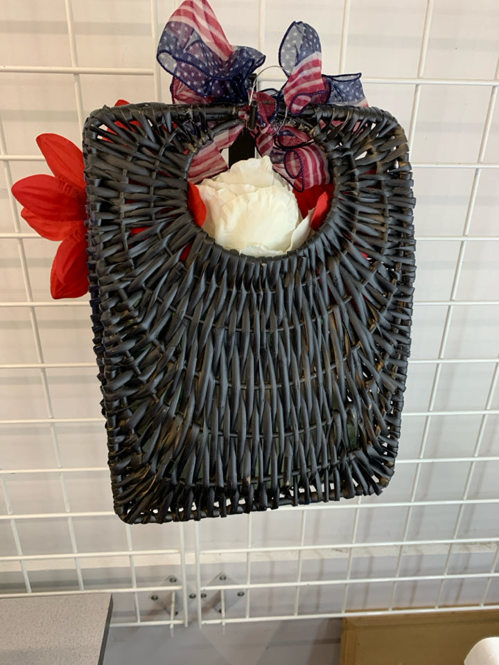RED WHITE AND BLUE BOUQUET IN BLUE BASKET.