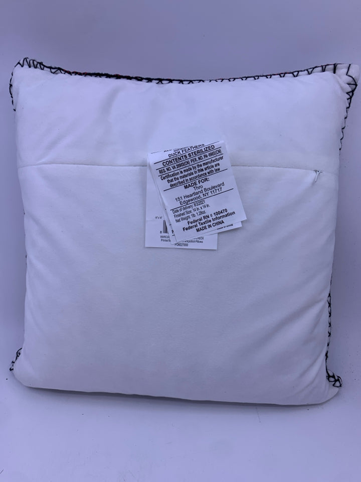 RED BUFFALO PLAID ACCENT PILLOW WITH SNOWFLAKES.
