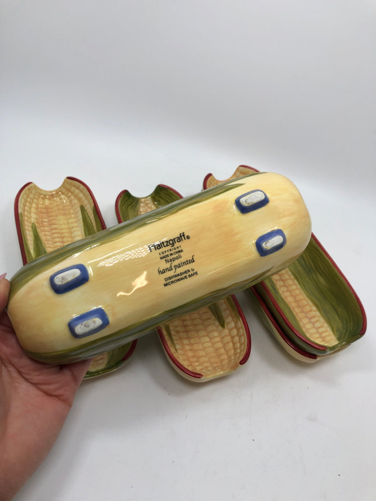 5 CERAMIC CORN HOLDERS.