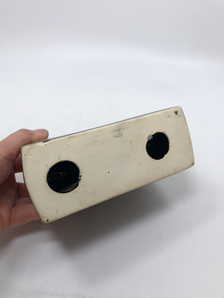 BLACK CERAMIC NAPKIN HOLDER.