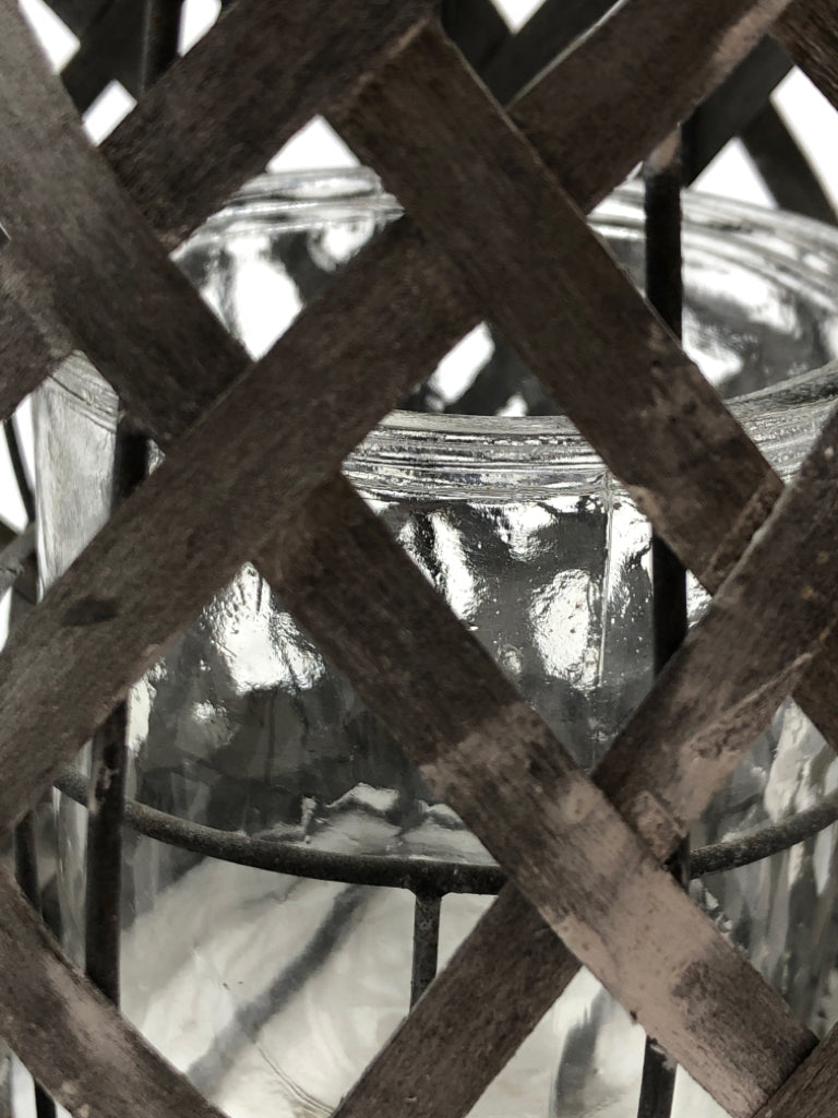 GRAY WOVEN CANDLE LANTERN.