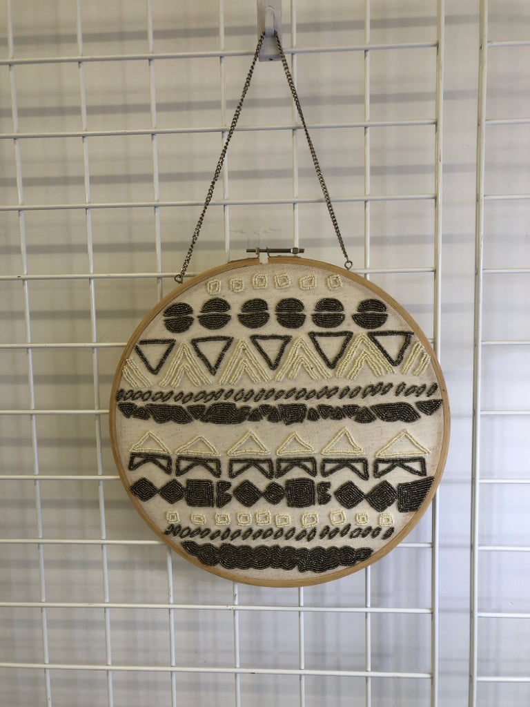 ROUND BEADED PATTERN WALL HANGING.