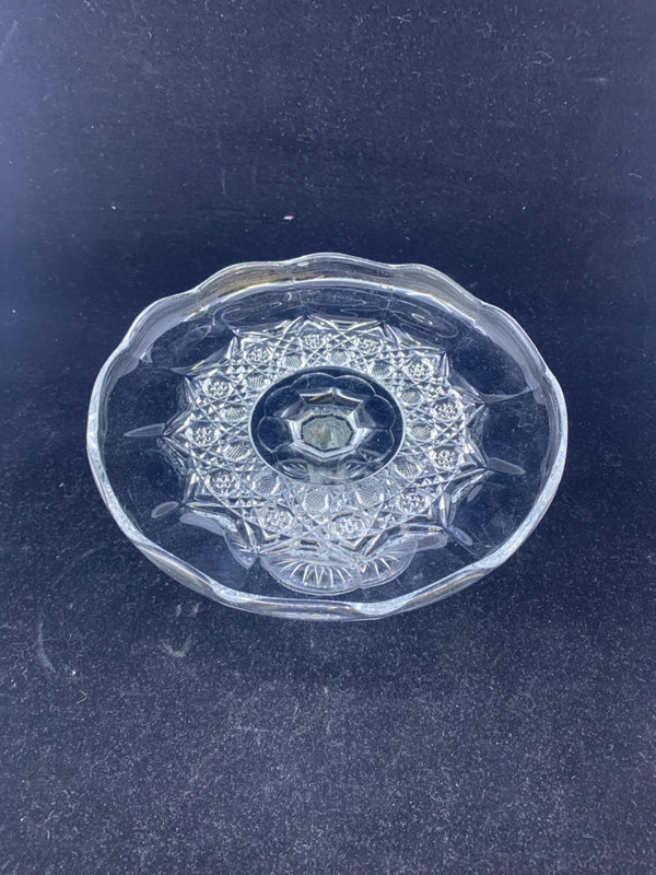SMALL GLASS FOOTED PLATTER W/ STAR DESIGN IN MIDDLE W/ SCALLOP EDGE.