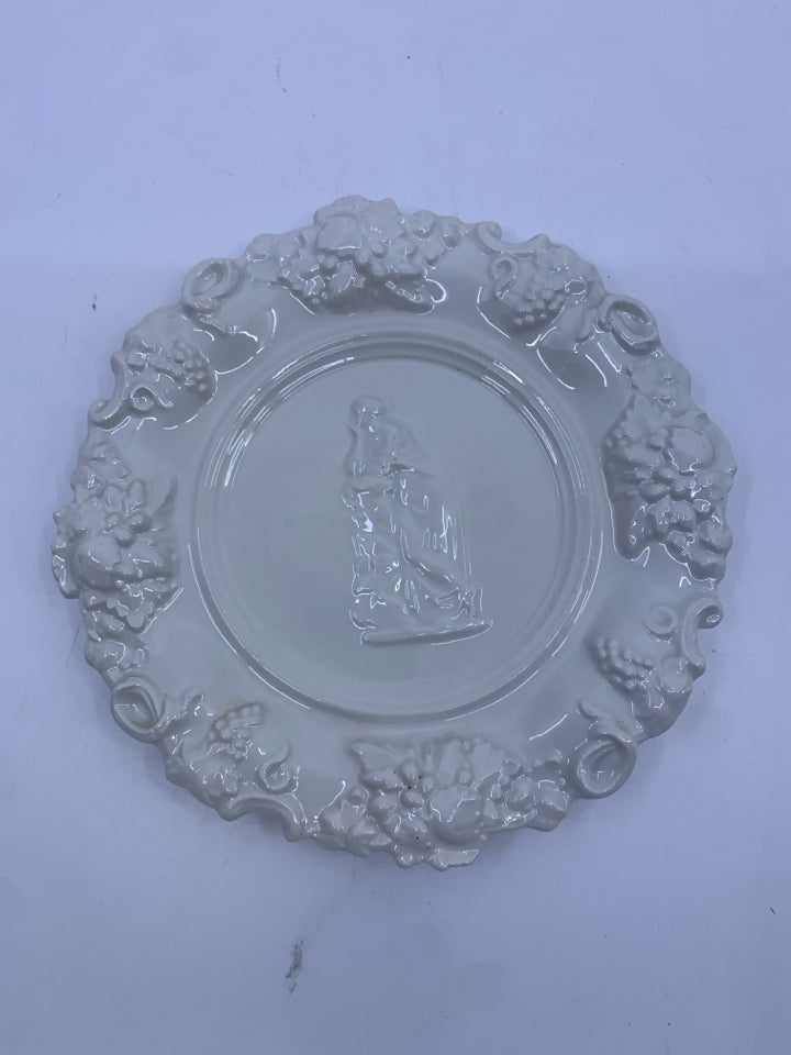 VTG EMBOSSED PLATE W WOMAN ON FRONT.