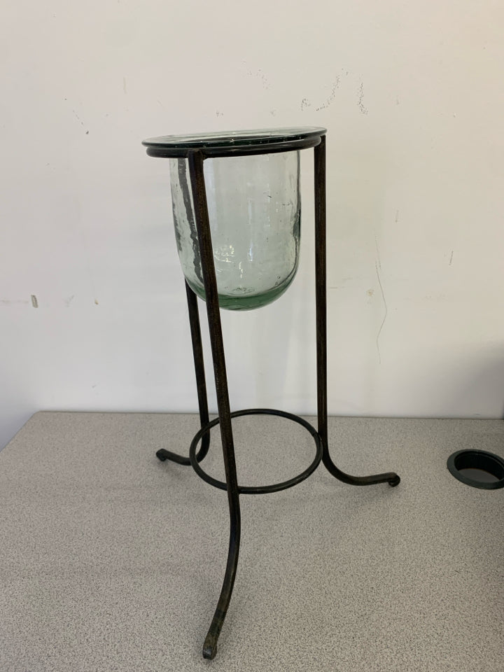 METAL STAND W/ GLASS CANDLE HOLDER CENTER.