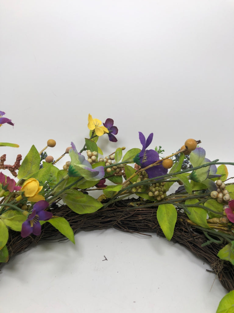 YELLOW AND PURPLE FAUX FLOWER WREATH.