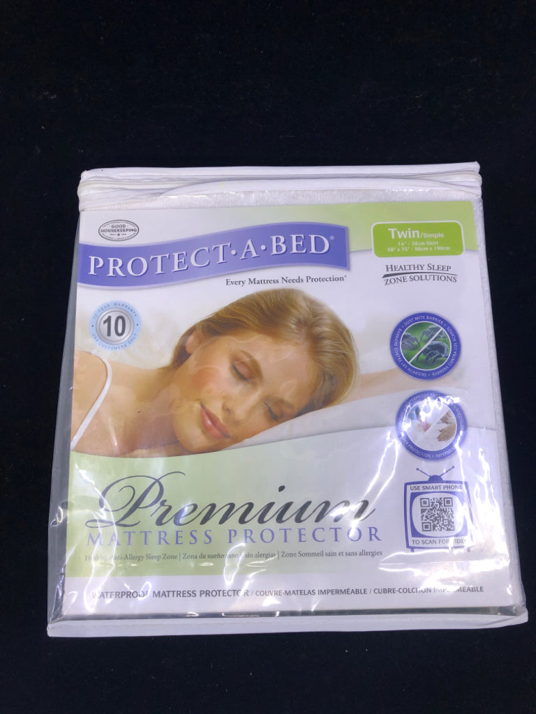 NIP PROTECT A BED TWIN MATTRESS PROTECTOR.