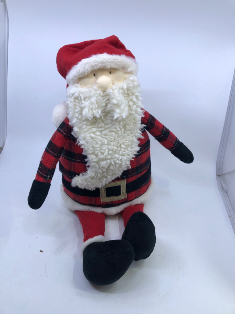 SITTING SHELF SANTA IN RED BUFFALO PLAID.