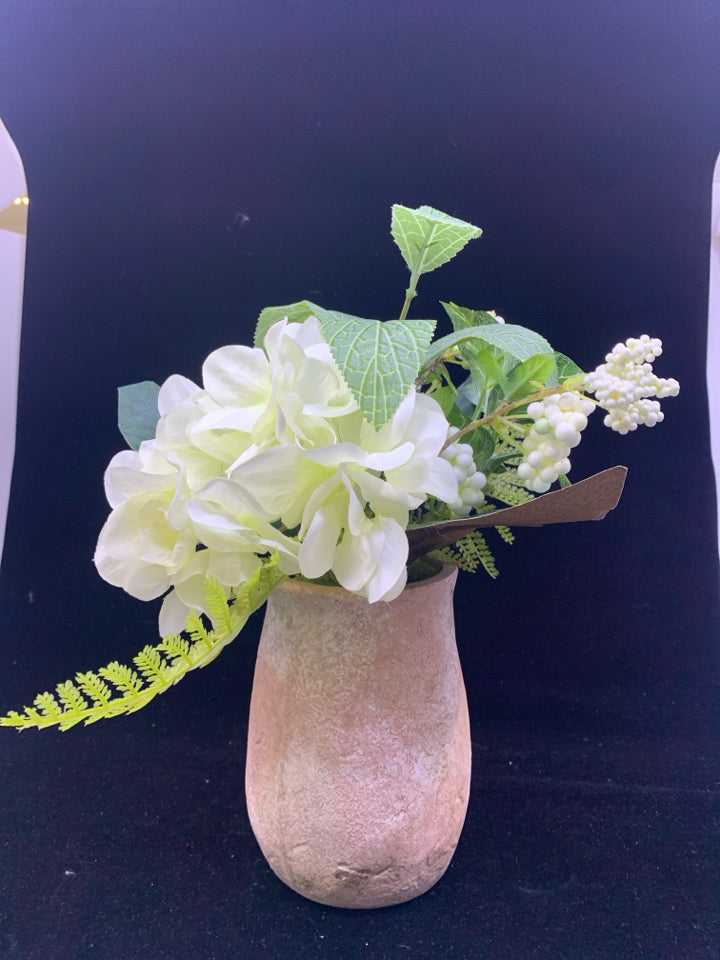 FAUX WHITE FLORAL AND GREENERY IN TERRA COTTA VASE.