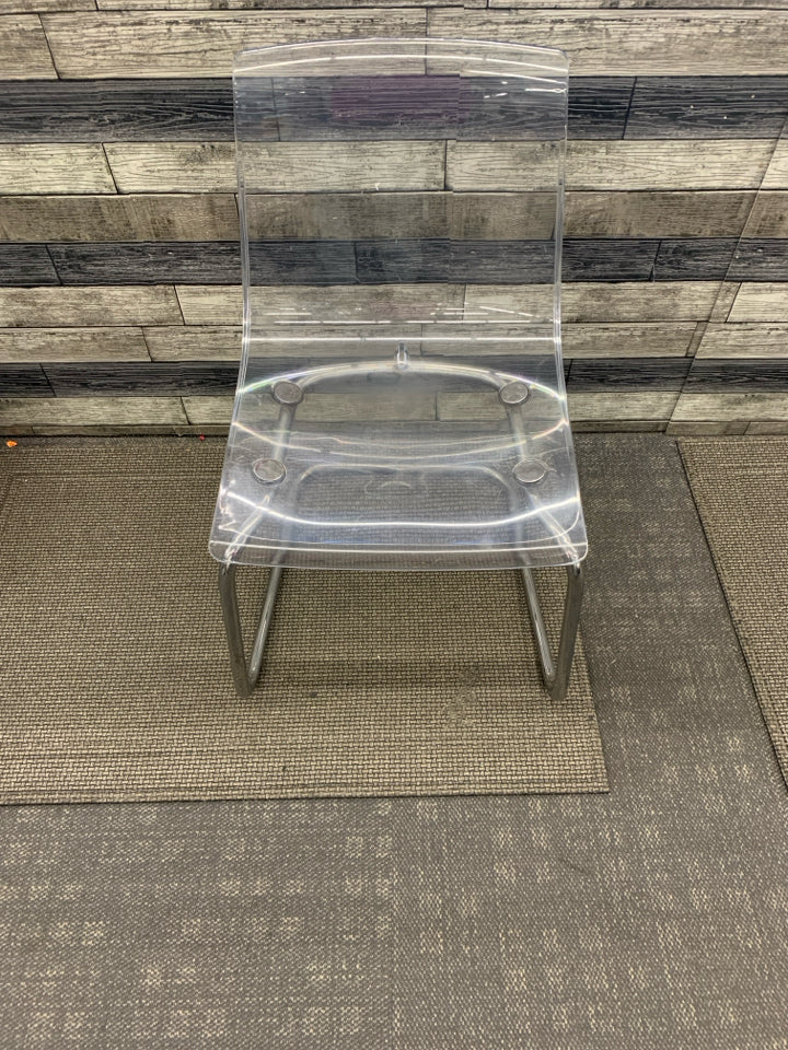 CLEAR IKEA CHAIR W/ METAL BOTTOM.