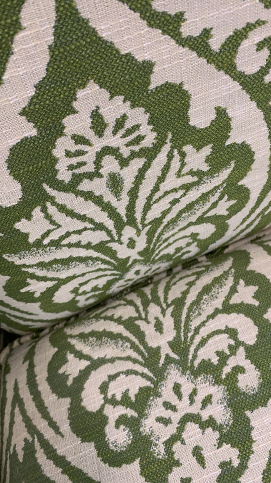 UPHOLSTERED GREEN PATTERNED ACCENT CHAIR.