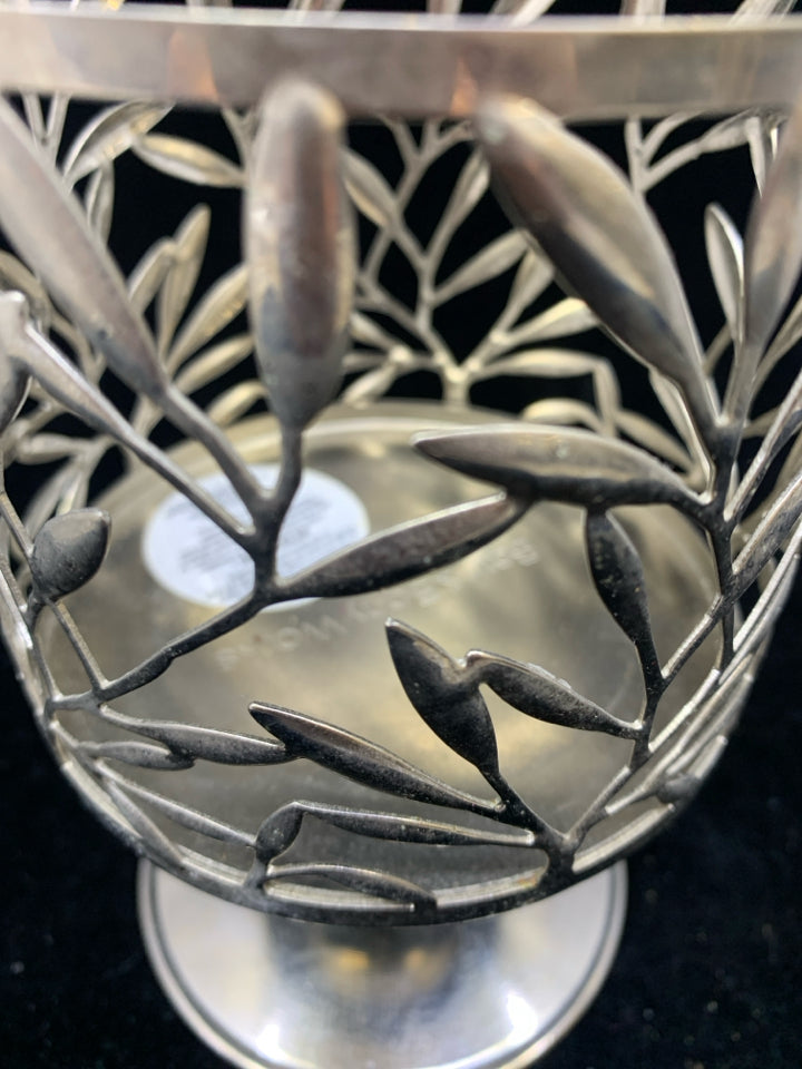 FOOTED SILVER METAL CANDLE SLEEVE LEAF DETAIL.