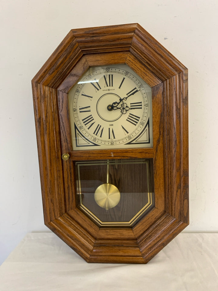 HOWARD MILLER WOOD HANGING CLOCK.