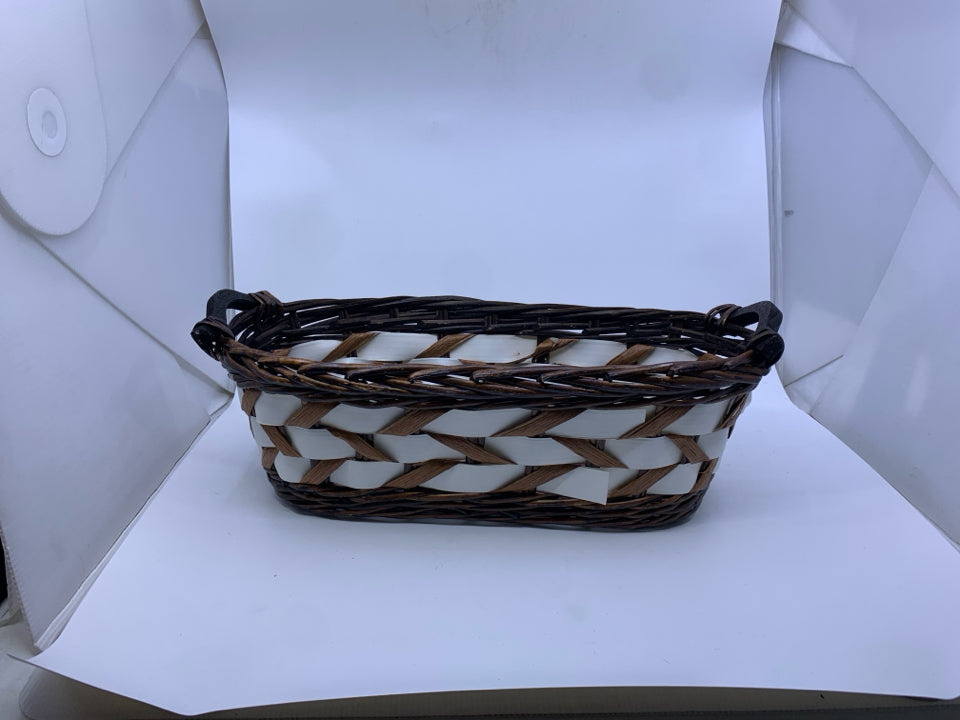 DARK WOVEN W WHITE ACCENTS OVAL BASKET.