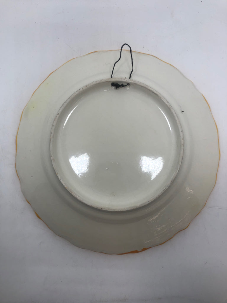 FLORAL EMBOSSED PLATE W/YELLOW RUFFLED EDGE.