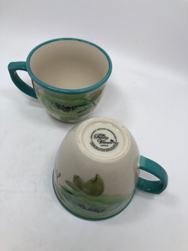 2 BLOOM TURQUOISE MUGS.