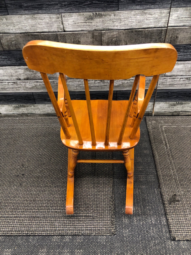 TAN CHILDRENS ROCKING CHAIR.