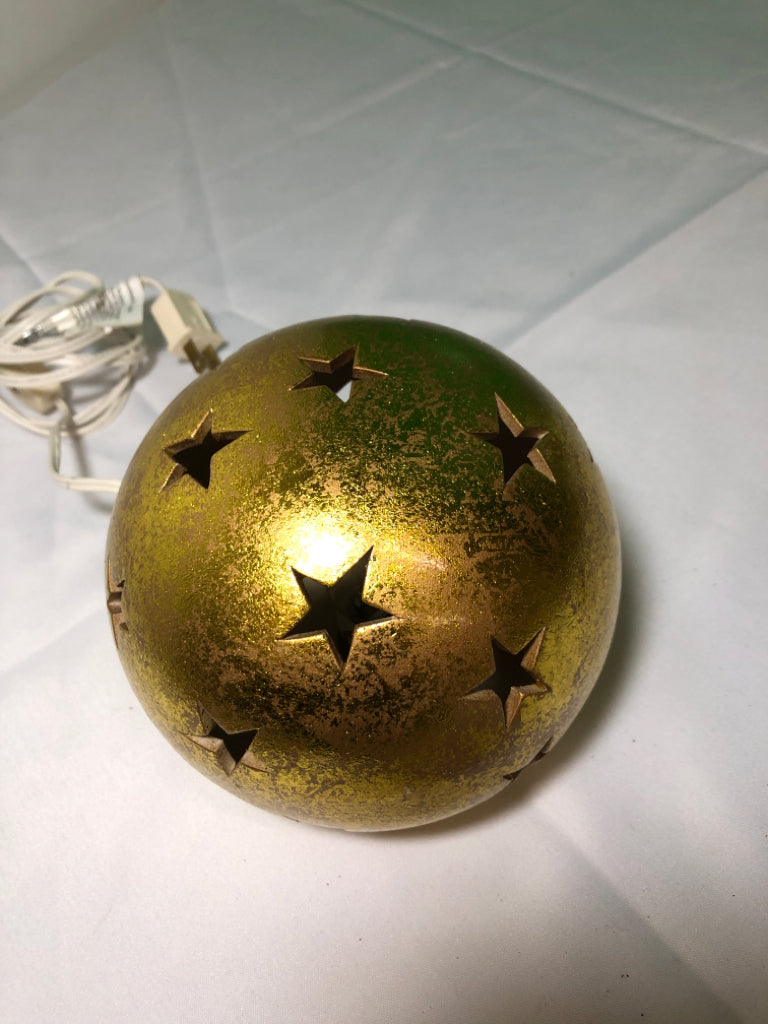 GOLD CERAMIC LAMP W/ STAR PIERCED CUTOUTS.