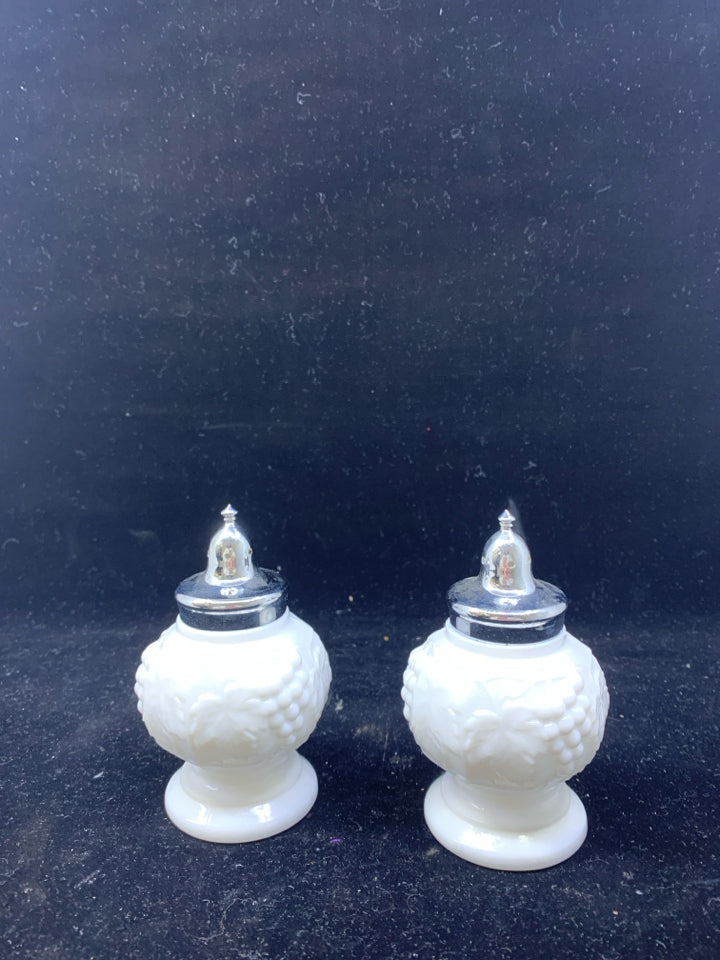 2 VTG MILK GLASS EMBOSSED SALT AND PEPPER SHAKERS.