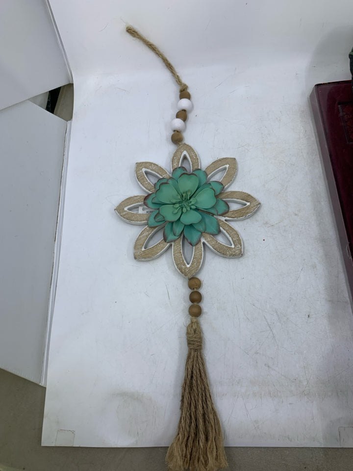 DISTRESSED FLOWER W/ TASSEL TEAL METAL.