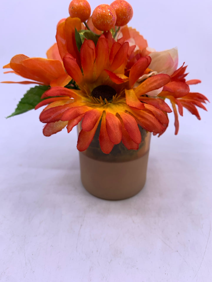 SMALL ORANGE FLORAL ARRANGEMENT.