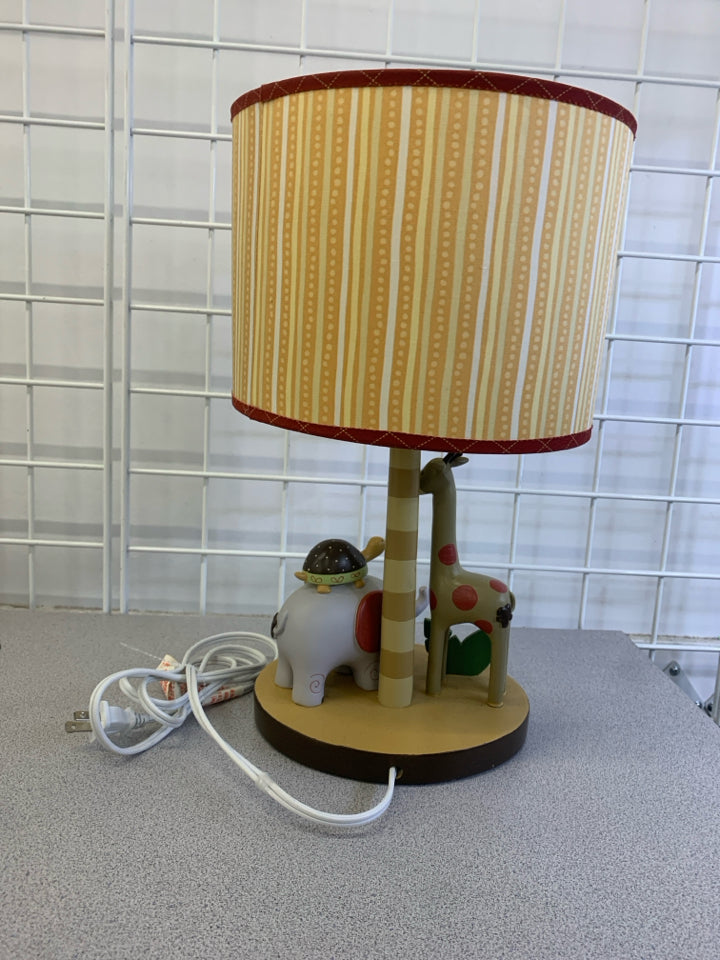 SAFARI ANIMALS LAMP W/ORANGE STRIPED SHADE.