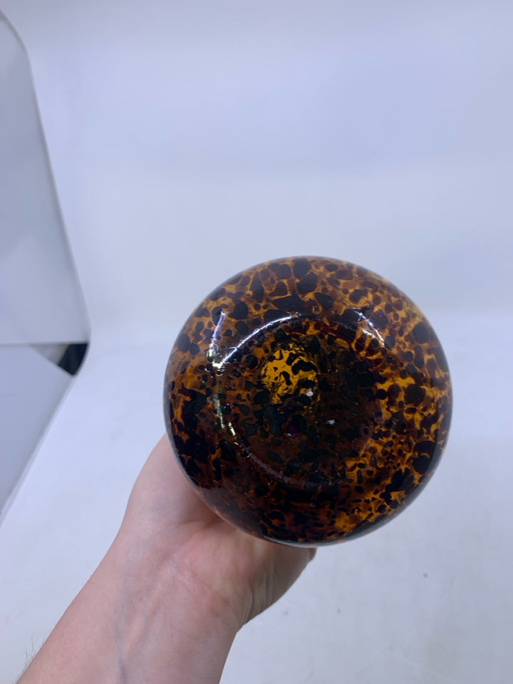 AMBER GLASS W/ LARGE BROWN SPOTS DECANTER W/ METAL STOPPER.