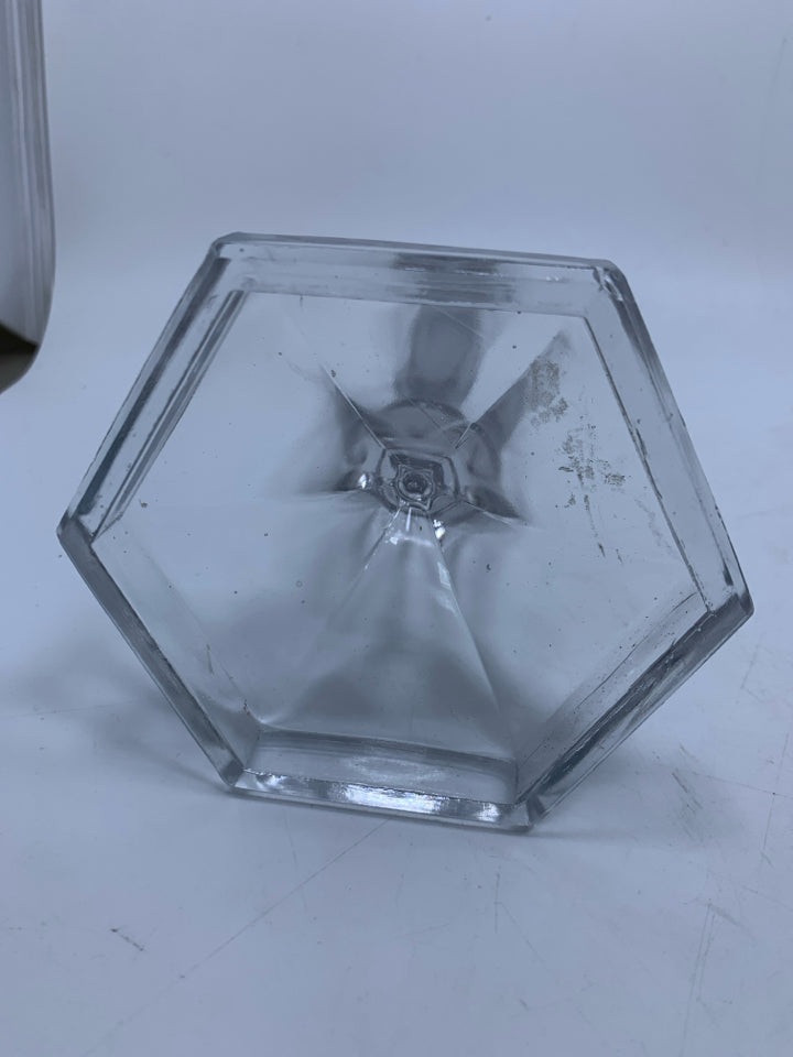CLEAR GLASS TAPERED CANDLE HOLDER W/ HEXAGON SHAPED BOTTOM ETCHED CIRCLES.