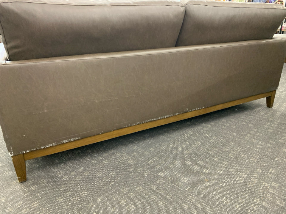 BROWN FAUX LEATHER COUCH.