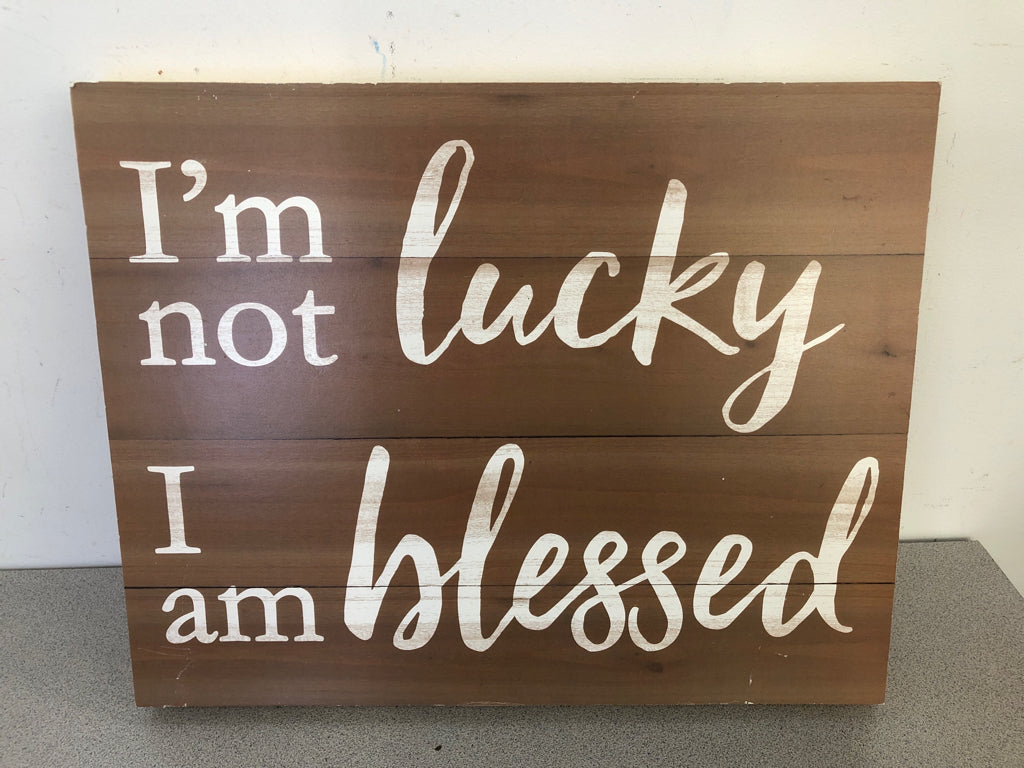 BROWN 'I'M NOT LUCKY' WALL HANGING.