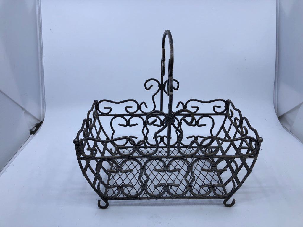 FOOTED METAL SCROLL BASKET W/ HANDLE.