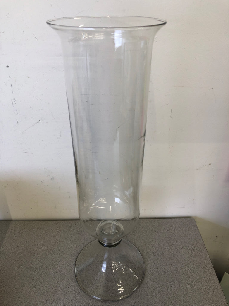 TALL FOOTED GLASS VASE.