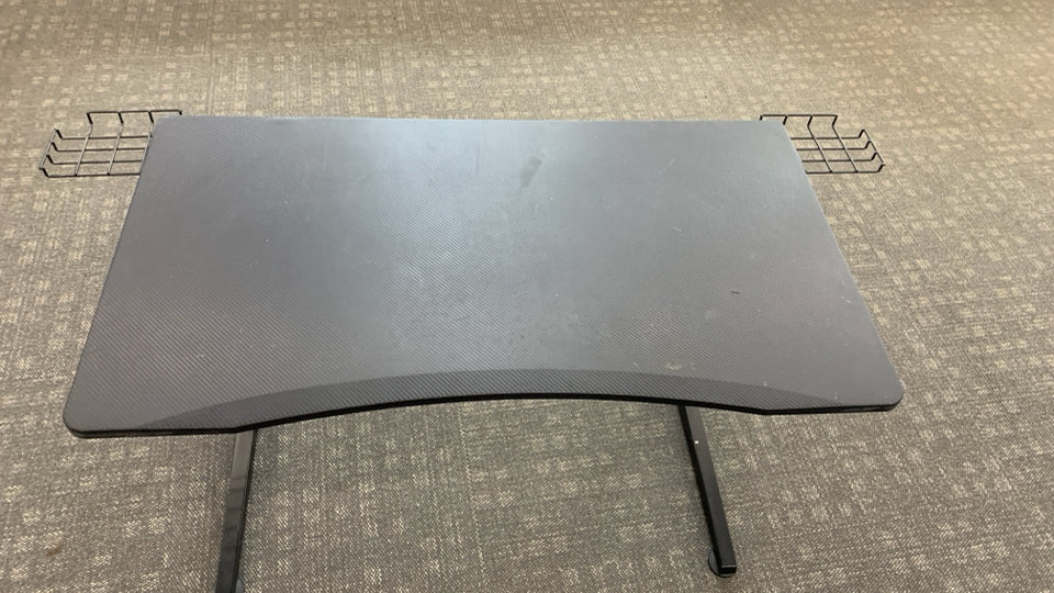 BLACK PLASTIC GAMING DESK W/ANGLED METAL LEGS.