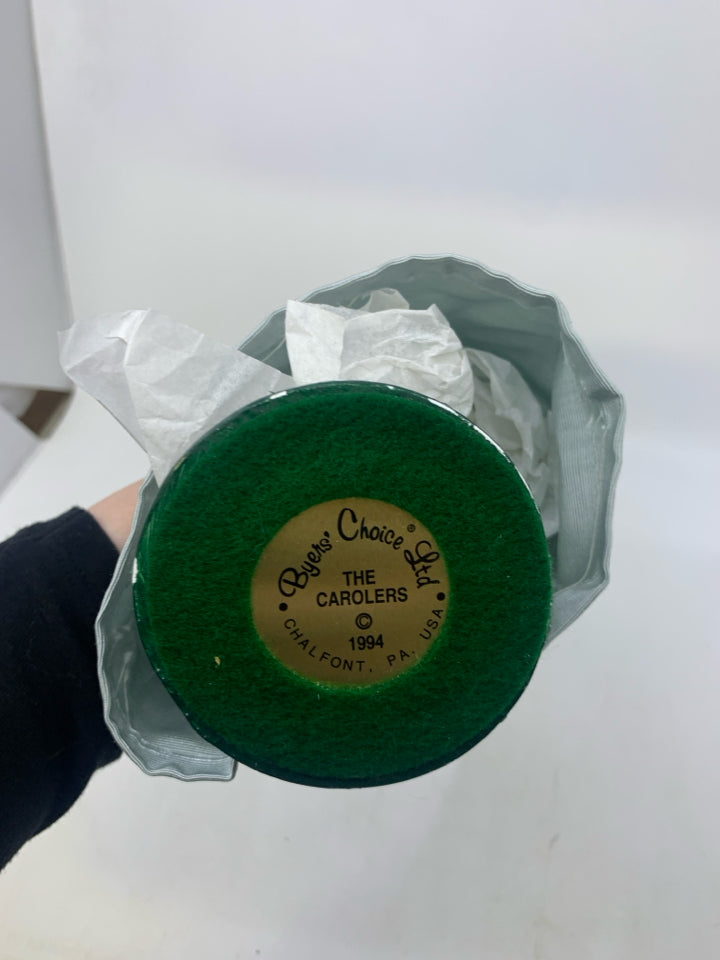 1994 BYERS' CHOICE WOMAN CAROLER IN BLUE DRESS.