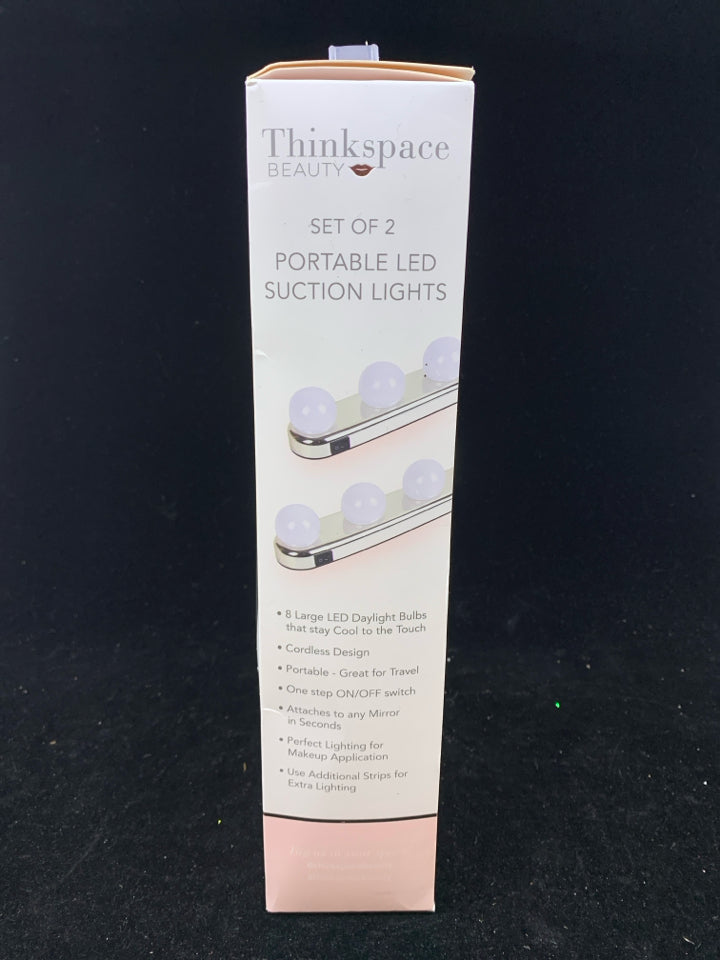 NIB PORTABLE SUCTION LIGHTS.