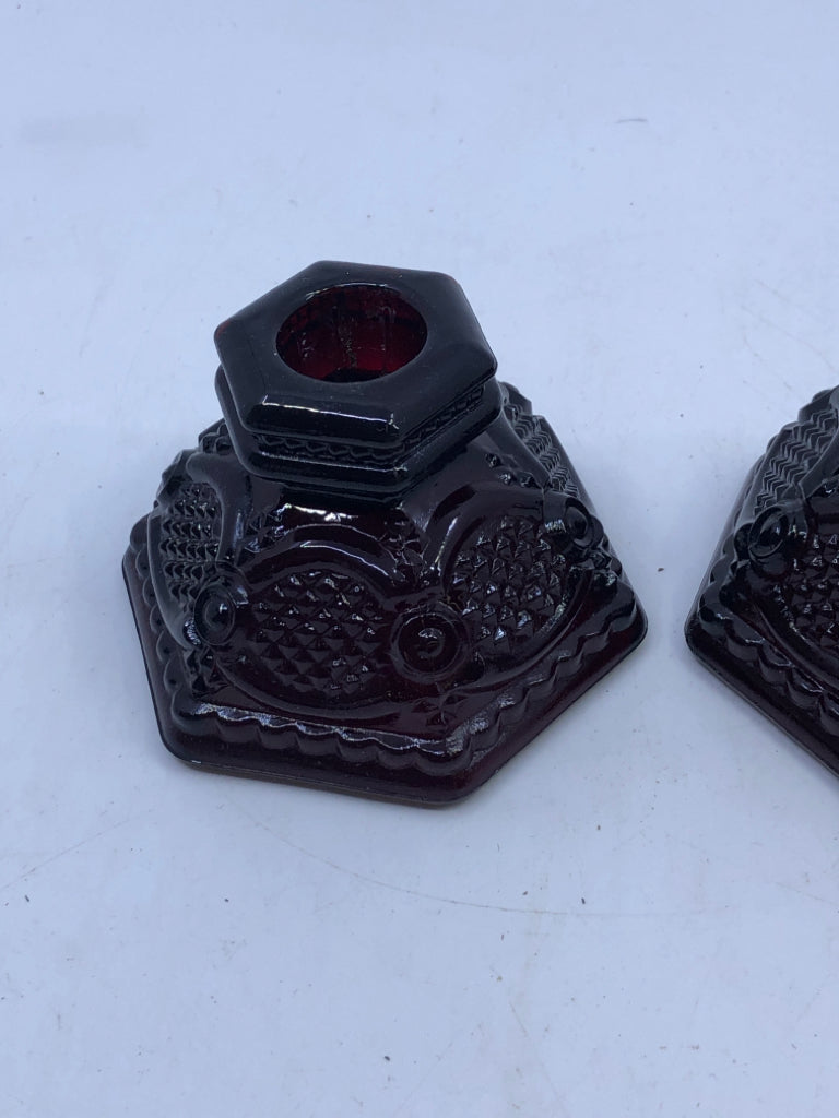 2 CRANBERRY GLASS TAPER CANDLE HOLDERS.