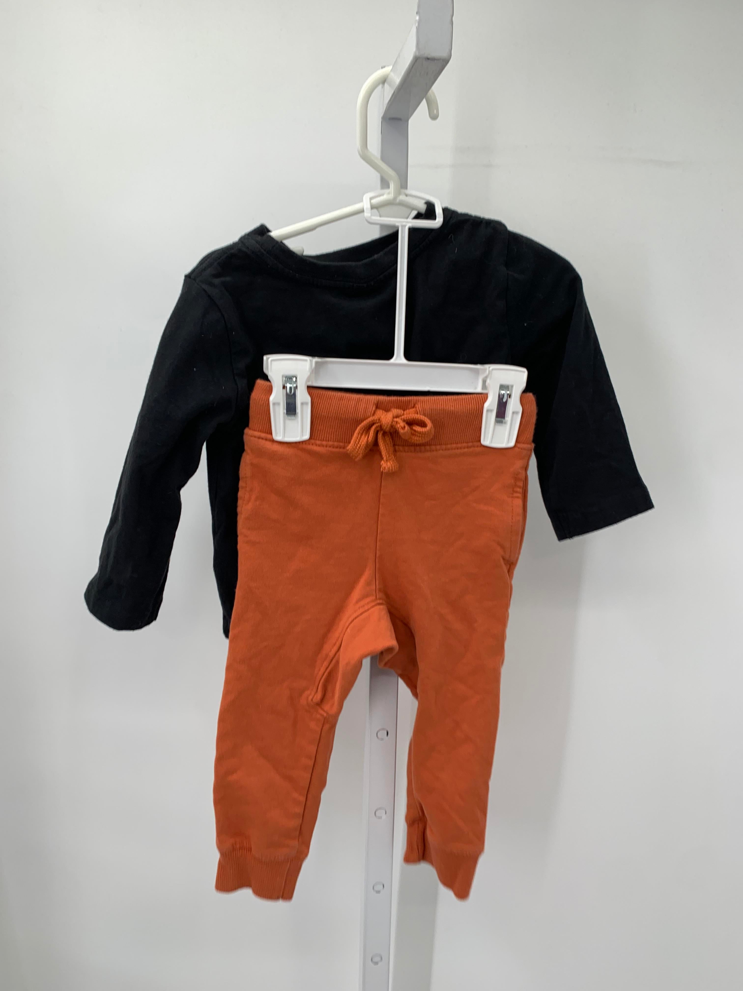 HAUNTED HOUSE SHIRT AND ORANGE PANTS.