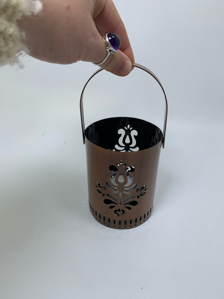 COPPER METAL COLORED PIERCED TEA LIGHT LANTERN CANDLE HOLDER.