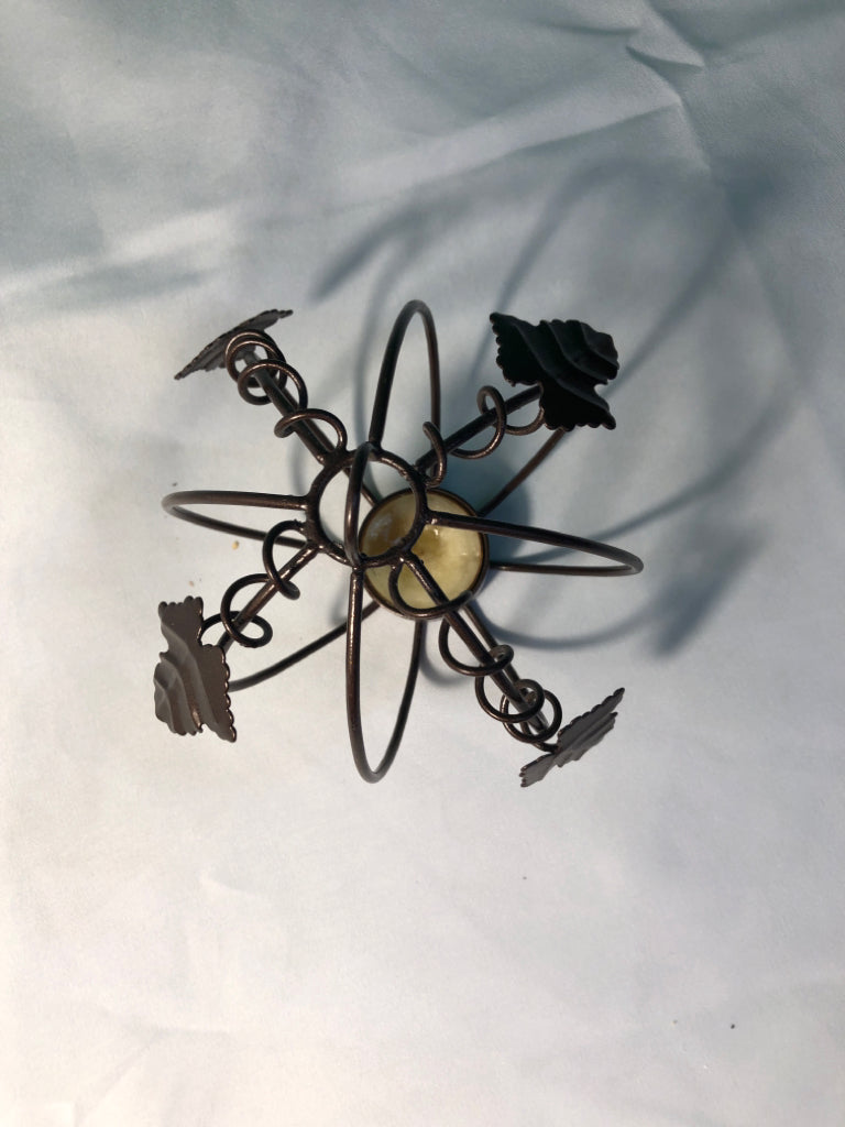 BROWN METAL PUMPKIN TEA LIGHT HOLDER.