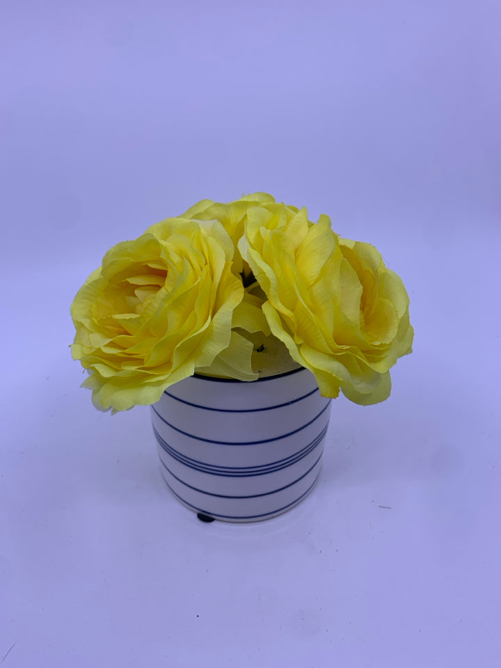 YELLOW FLORAL IN BLUE AND WHITE VASE.