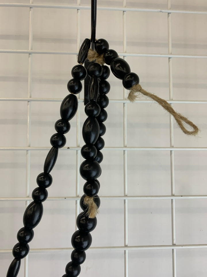 BLACK WOODEN BEADED GARLAND.