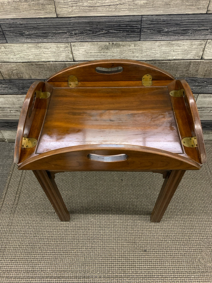 DARK BROWN RAISED EDGE ROUND TABLE.