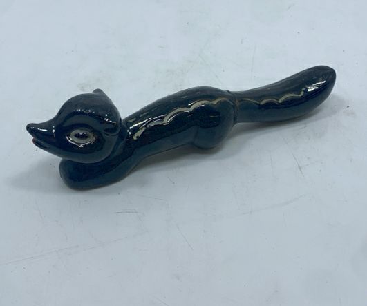 SM CERAMIC BLACK SKUNK FIGURINE.