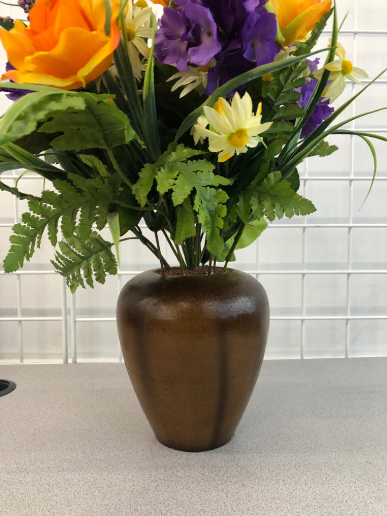 PURPLE/ORANGE FLOWERS IN BROWN VASE.
