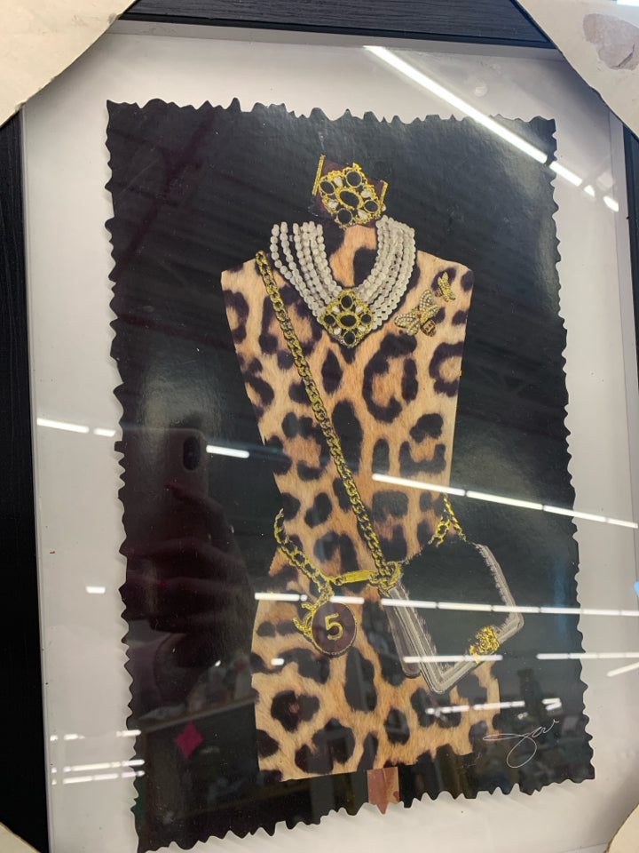 GOLD PARIS MANNEQUIN FORM IN BLACK FRAME.