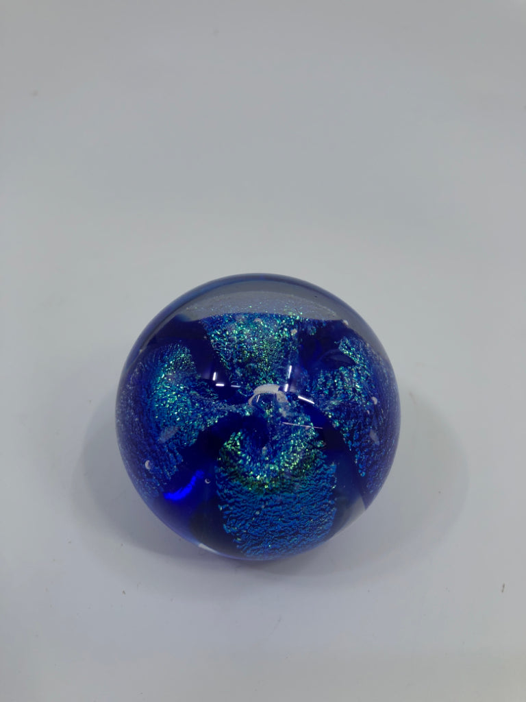 GES ROUND GLASS PAPERWEIGHT W/BLUE IRIDESCENT SHIMMER.