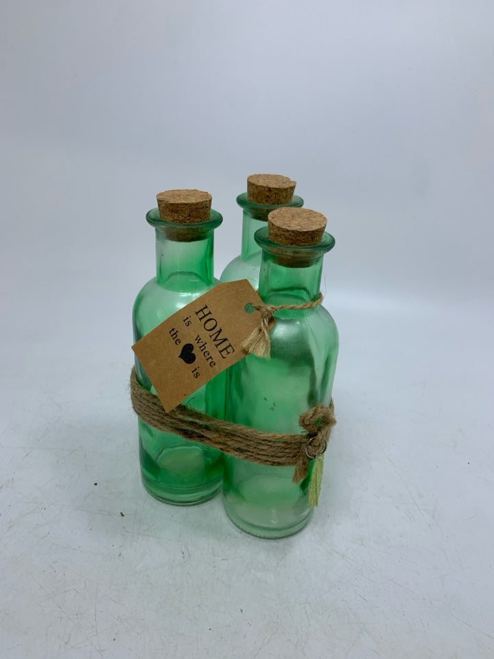 3 GREEN BOTTLE WRAPPED TOGETHER W/ CORK TOPS.